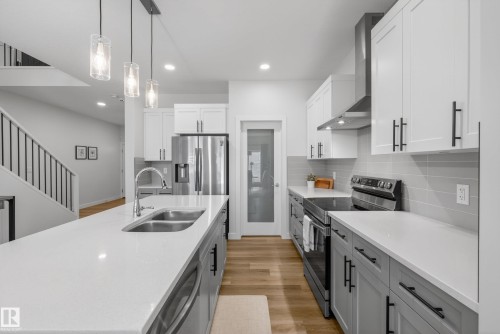 9309 Pear Link Link, Edmonton, AB - Indoor Photo Showing Kitchen With Stainless Steel Kitchen With Double Sink With Upgraded Kitchen