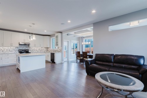 Open-concept living space featuring wood-finish flooring - 3571 Keswick Boulevard, Edmonton, AB - Indoor
