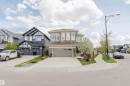 Two-story residence featuring a stone and stucco exterior, an attached two-car garage, and a concrete driveway - 3571 Keswick Boulevard, Edmonton, AB  - Outdoor With Facade 
