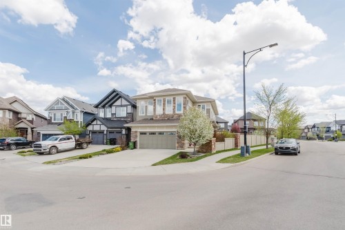 Contemporary residential streetscape featuring diverse architectural styles - 3571 Keswick Boulevard, Edmonton, AB - Outdoor With Facade