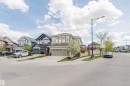Contemporary residential streetscape featuring diverse architectural styles - 3571 Keswick Boulevard, Edmonton, AB  - Outdoor With Facade 