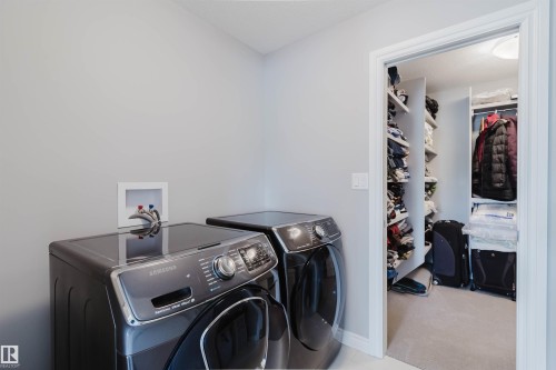 Dedicated laundry area featuring a wall-mounted utility box - 3571 Keswick Boulevard, Edmonton, AB - Indoor Photo Showing Laundry Room