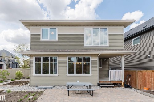 Two-story exterior featuring horizontal siding and multiple windows - 3571 Keswick Boulevard, Edmonton, AB - Outdoor