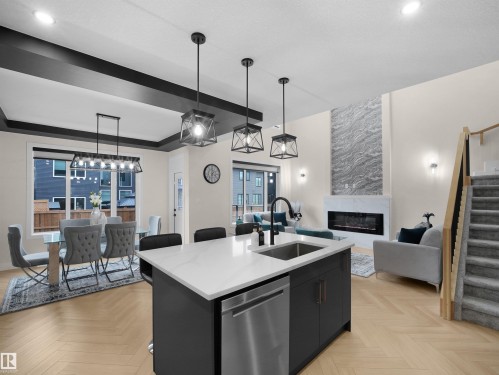 7214 Kiviaq Link, Edmonton, AB - Indoor Photo Showing Kitchen With Fireplace With Upgraded Kitchen