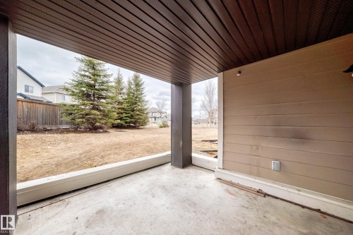 The property features a covered patio with a concrete floor, offering an outdoor living space - 101 530 Watt Boulevard, Edmonton, AB - Outdoor With Deck Patio Veranda With Exterior