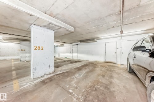 Dedicated parking space with a concrete floor and clear overhead lighting - 101 530 Watt Boulevard, Edmonton, AB - Indoor Photo Showing Garage