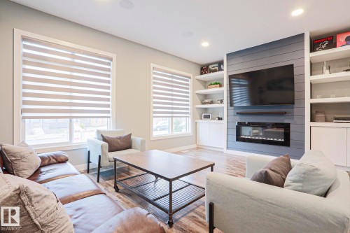 661 Lewis Greens Drive, Edmonton, AB - Indoor Photo Showing Living Room With Fireplace