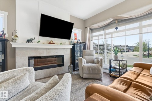 34 Brickyard Drive, Stony Plain, AB - Indoor Photo Showing Living Room With Fireplace