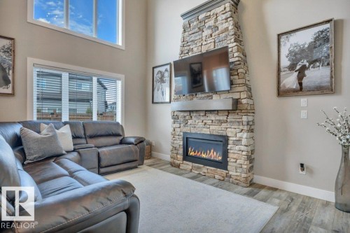 777 Berg Loop, Leduc, AB - Indoor Photo Showing Living Room With Fireplace