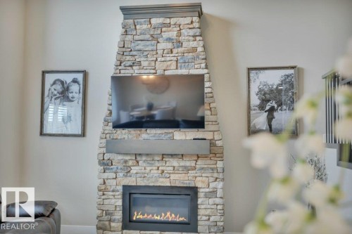 777 Berg Loop, Leduc, AB - Indoor Photo Showing Living Room With Fireplace