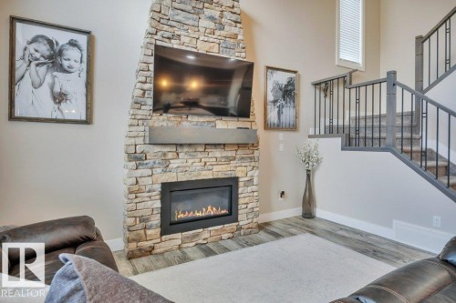 777 Berg Loop, Leduc, AB - Indoor Photo Showing Living Room With Fireplace