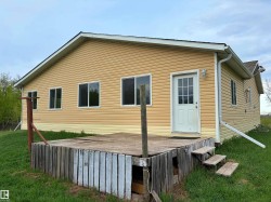 Exterior with horizontal vinyl siding and a gable roof - 