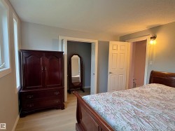 Light wood-finish flooring complements neutral wall tones - 