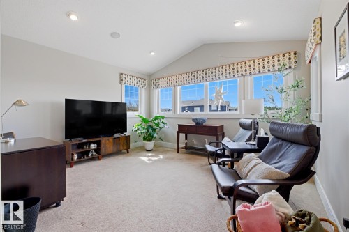 Carpeted room featuring a vaulted ceiling with recessed lighting and built-in speakers - 1359 Westerra Drive, Stony Plain, AB - Indoor Photo Showing Living Room