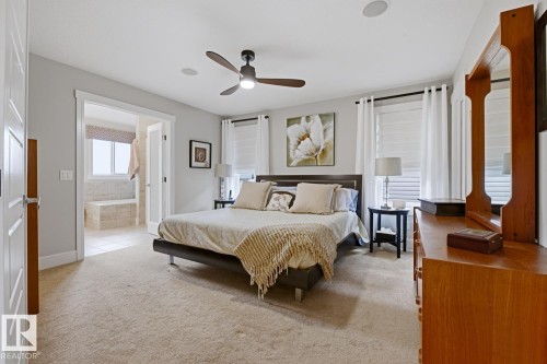 Carpeted room with a contemporary ceiling fan and recessed lighting - 1359 Westerra Drive, Stony Plain, AB - Indoor Photo Showing Bedroom