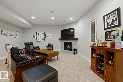 Living room - 1359 Westerra Drive, Stony Plain, AB - Indoor With Fireplace