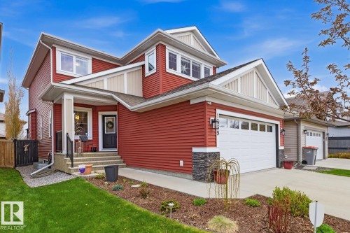 Two-story residence featuring red siding and white trim accents - 1359 Westerra Drive, Stony Plain, AB - Outdoor