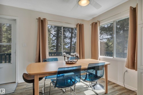 Dining area featuring wood-finish flooring and a ceiling fan with integrated lighting - 305 3 St, Rural Wetaskiwin County, AB - Indoor Photo Showing Dining Room