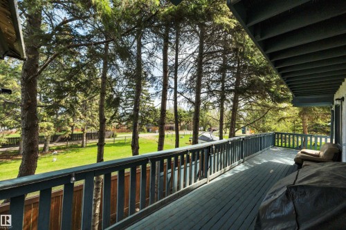 Spacious outdoor deck with a painted wood floor and railings - 305 3 St, Rural Wetaskiwin County, AB - Outdoor With Deck Patio Veranda With Exterior