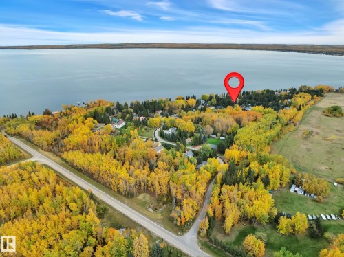 Image quality insufficient for description - 305 3 St, Rural Wetaskiwin County, AB - Outdoor With Body Of Water With View