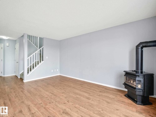 6424 1A Avenue, Edmonton, AB - Indoor Photo Showing Other Room With Fireplace
