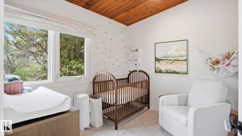 Vaulted wood-finish ceiling accentuates this room featuring white walls, double pane windows, and light-toned carpeting - 6412 Ada Boulevard, Edmonton, AB - Indoor Photo Showing Other Room