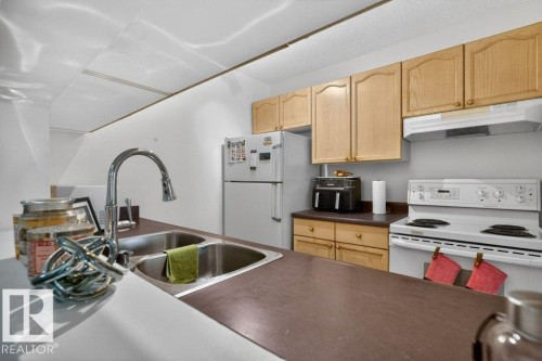 111 11218 80 Street, Edmonton, AB - Indoor Photo Showing Kitchen With Double Sink