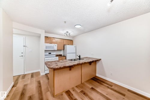108 12838 65 Street, Edmonton, AB - Indoor Photo Showing Kitchen With Double Sink