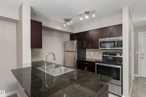 409 5804 Mullen Place, Edmonton, AB - Indoor Photo Showing Kitchen With Stainless Steel Kitchen With Double Sink With Upgraded Kitchen