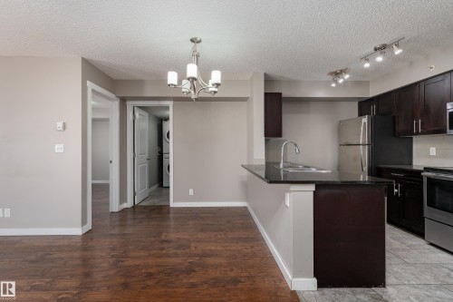 409 5804 Mullen Place, Edmonton, AB - Indoor Photo Showing Kitchen With Stainless Steel Kitchen