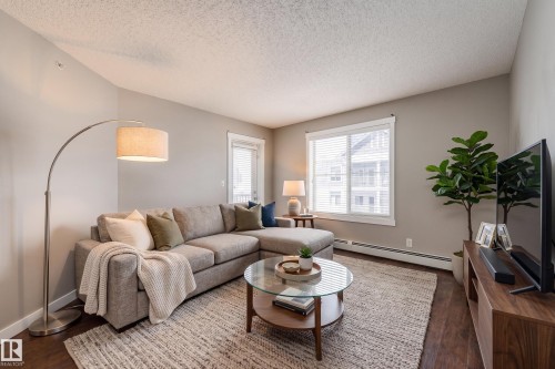 409 5804 Mullen Place, Edmonton, AB - Indoor Photo Showing Living Room