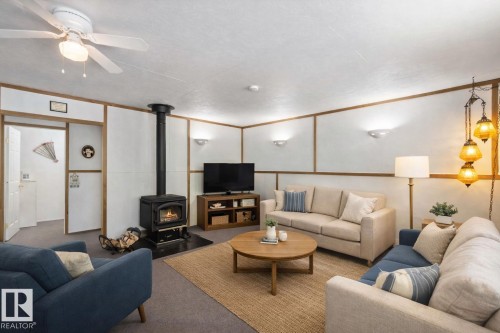 37 59316 Range Road 54, Rural Barrhead County, AB - Indoor Photo Showing Living Room With Fireplace