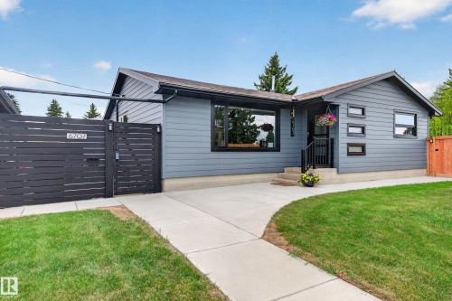 Contemporary exterior with gray siding and black trim windows - 6707 92B Avenue, Edmonton, AB - Outdoor