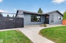 Contemporary exterior with gray siding and black trim windows - 6707 92B Avenue, Edmonton, AB  - Outdoor 