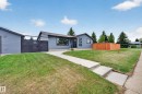Contemporary bungalow with gray siding, featuring a prominent front lawn and concrete walkway - 6707 92B Avenue, Edmonton, AB  - Outdoor 
