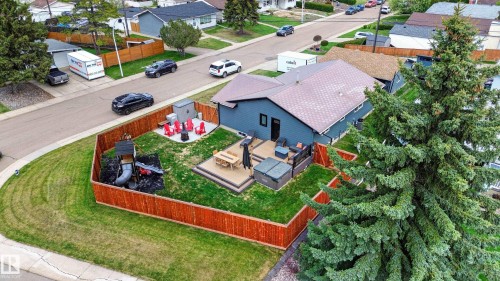 Spacious backyard featuring a multi-level deck, hot tub, and fenced perimeter - 6707 92B Avenue, Edmonton, AB - Outdoor