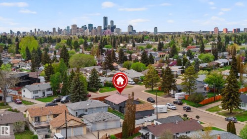 Aerial perspective of a residential neighborhood with a distant cityscape - 6707 92B Avenue, Edmonton, AB - Outdoor With View