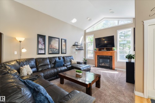 68 Linksview Bay, Spruce Grove, AB - Indoor Photo Showing Living Room With Fireplace
