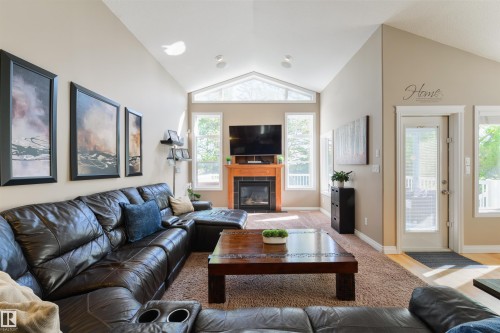 68 Linksview Bay, Spruce Grove, AB - Indoor Photo Showing Living Room With Fireplace