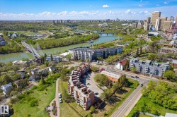Aerial perspective showcasing a vibrant urban landscape, river, and green spaces - 