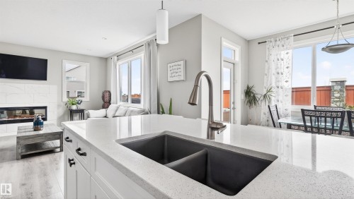 1723 200 Street Nw, Edmonton, AB - Indoor Photo Showing Kitchen With Fireplace With Double Sink
