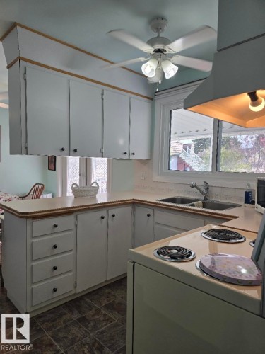 10908 30 Street, Edmonton, AB - Indoor Photo Showing Kitchen With Double Sink