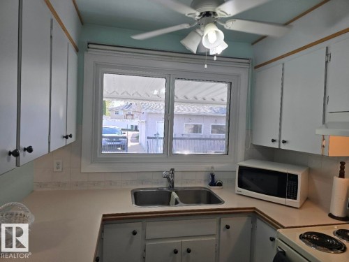 10908 30 Street, Edmonton, AB - Indoor Photo Showing Kitchen With Double Sink