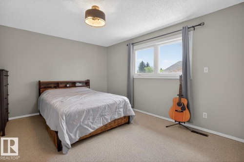 Primary Bedroom - on its own floor! Enjoy Privacy, your own 4 Piece Bathroom, and ample space for your bedroom suite. - 18655 61 Avenue, Edmonton, AB - Indoor Photo Showing Bedroom