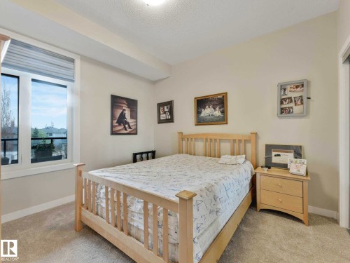 Image quality insufficient for description - 213 625 Leger Way, Edmonton, AB - Indoor Photo Showing Bedroom