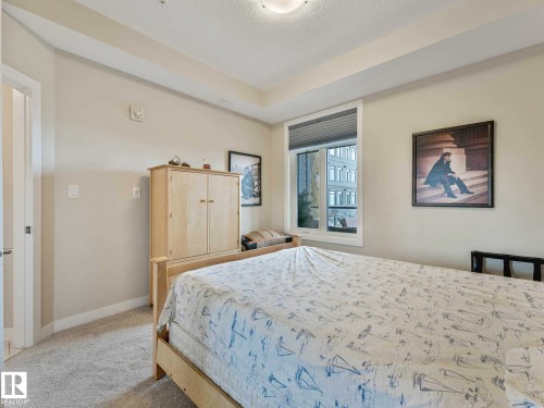 Image quality insufficient for description - 213 625 Leger Way, Edmonton, AB - Indoor Photo Showing Bedroom