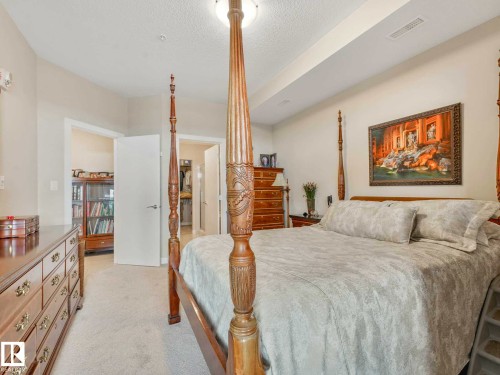 Image quality insufficient for description - 213 625 Leger Way, Edmonton, AB - Indoor Photo Showing Bedroom