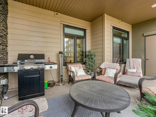 Image quality insufficient for description - 213 625 Leger Way, Edmonton, AB - Outdoor With Deck Patio Veranda With Exterior