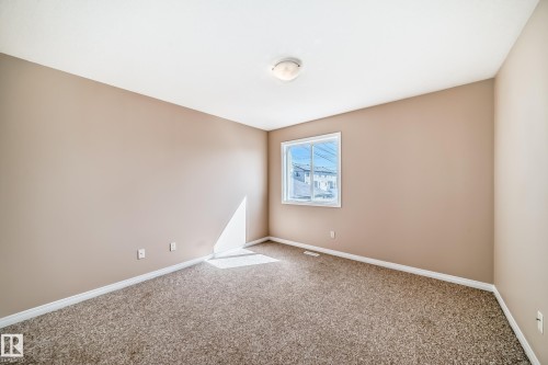 Carpeted room with neutral wall tones and white baseboards - 9825 156 Street, Edmonton, AB - Indoor Photo Showing Other Room