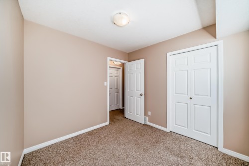 Neutral-toned walls complement the textured brown carpeting - 9825 156 Street, Edmonton, AB - Indoor